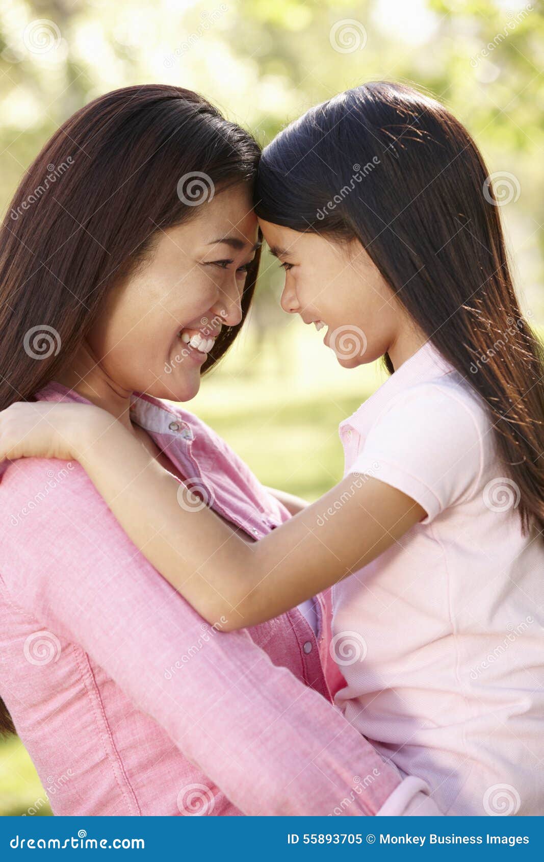 portrait asian mother daughter outdoors
